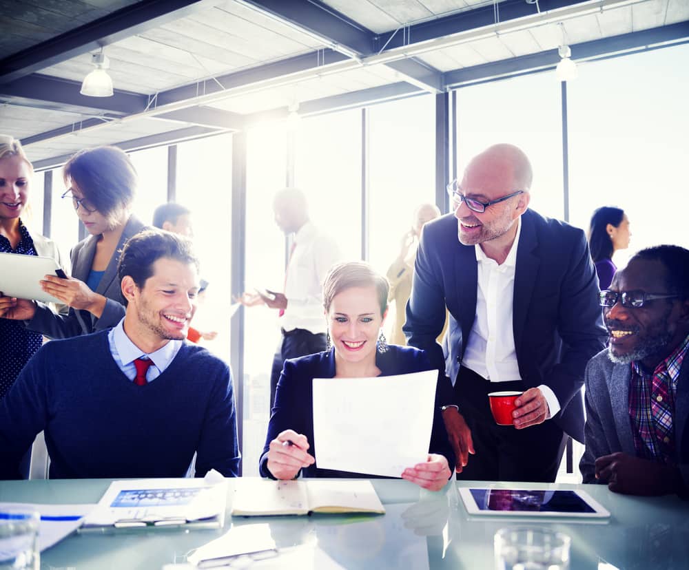Happy employees enjoying benefits of inspired workplace culture