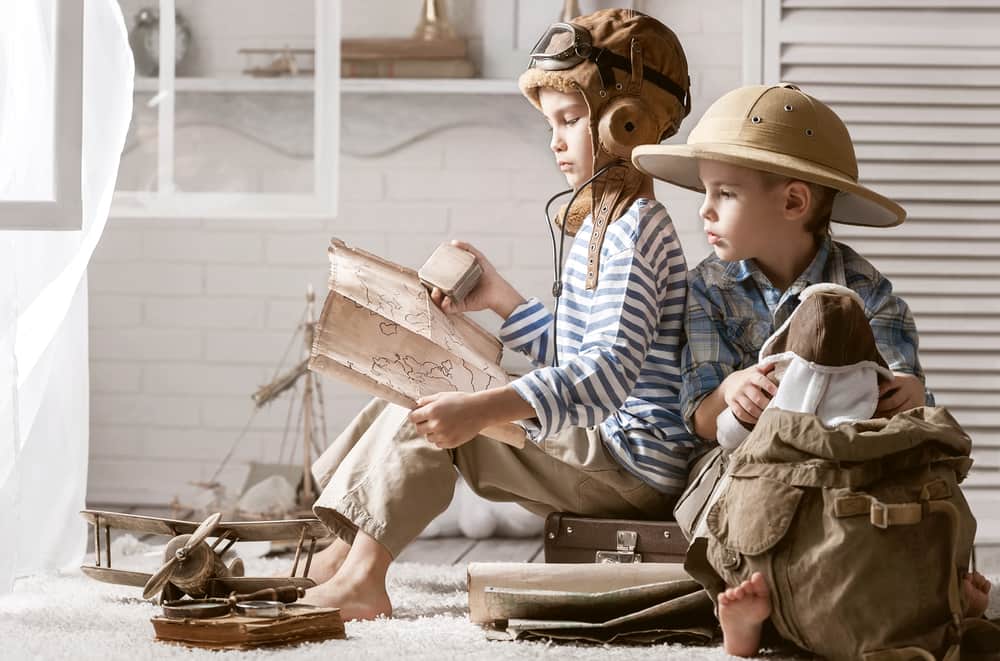 Two boys with different hats illustrate that effective leaders wear two hats